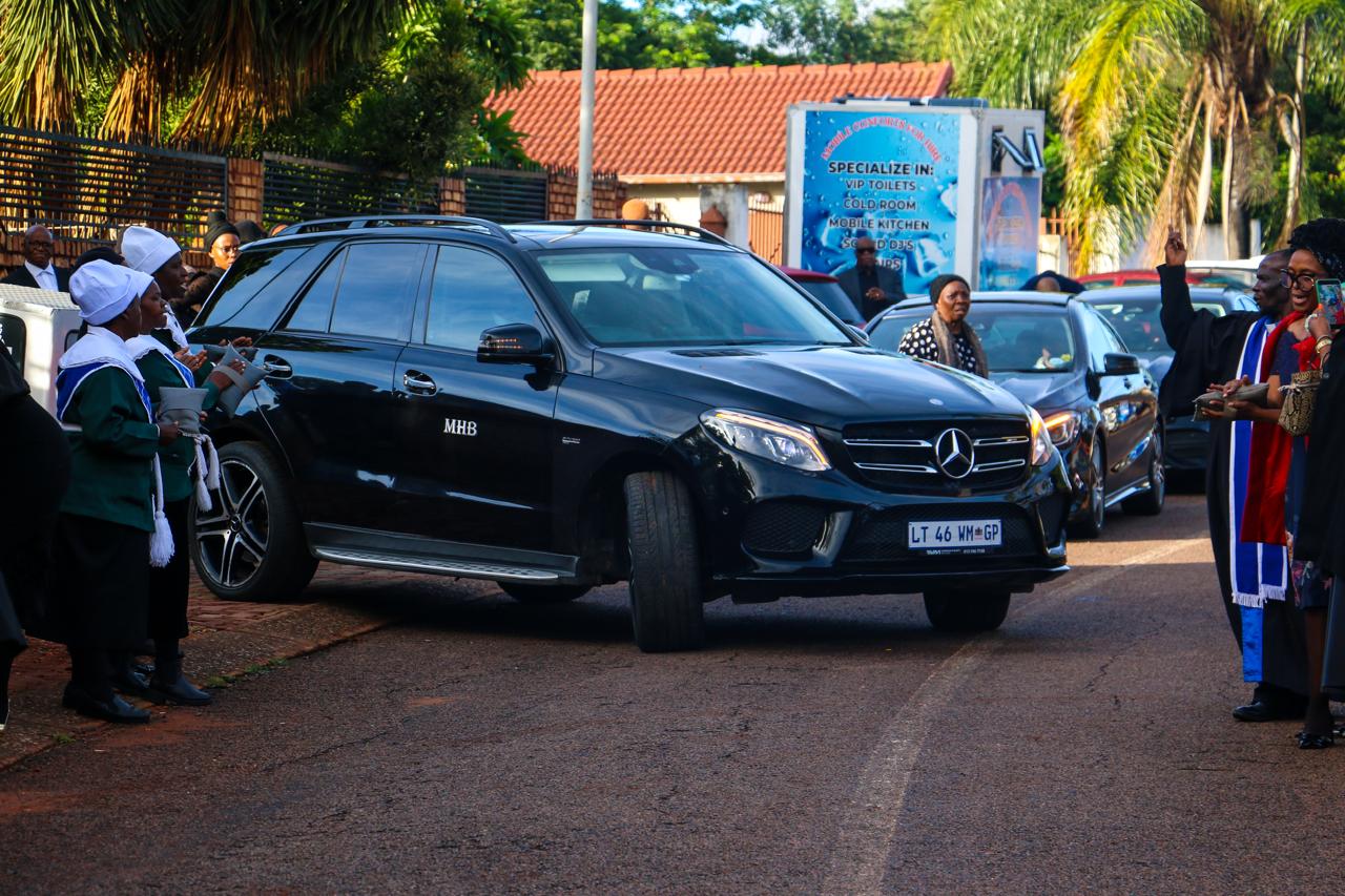 Black MHB branded Mercedes-Benz SUV departing a home service