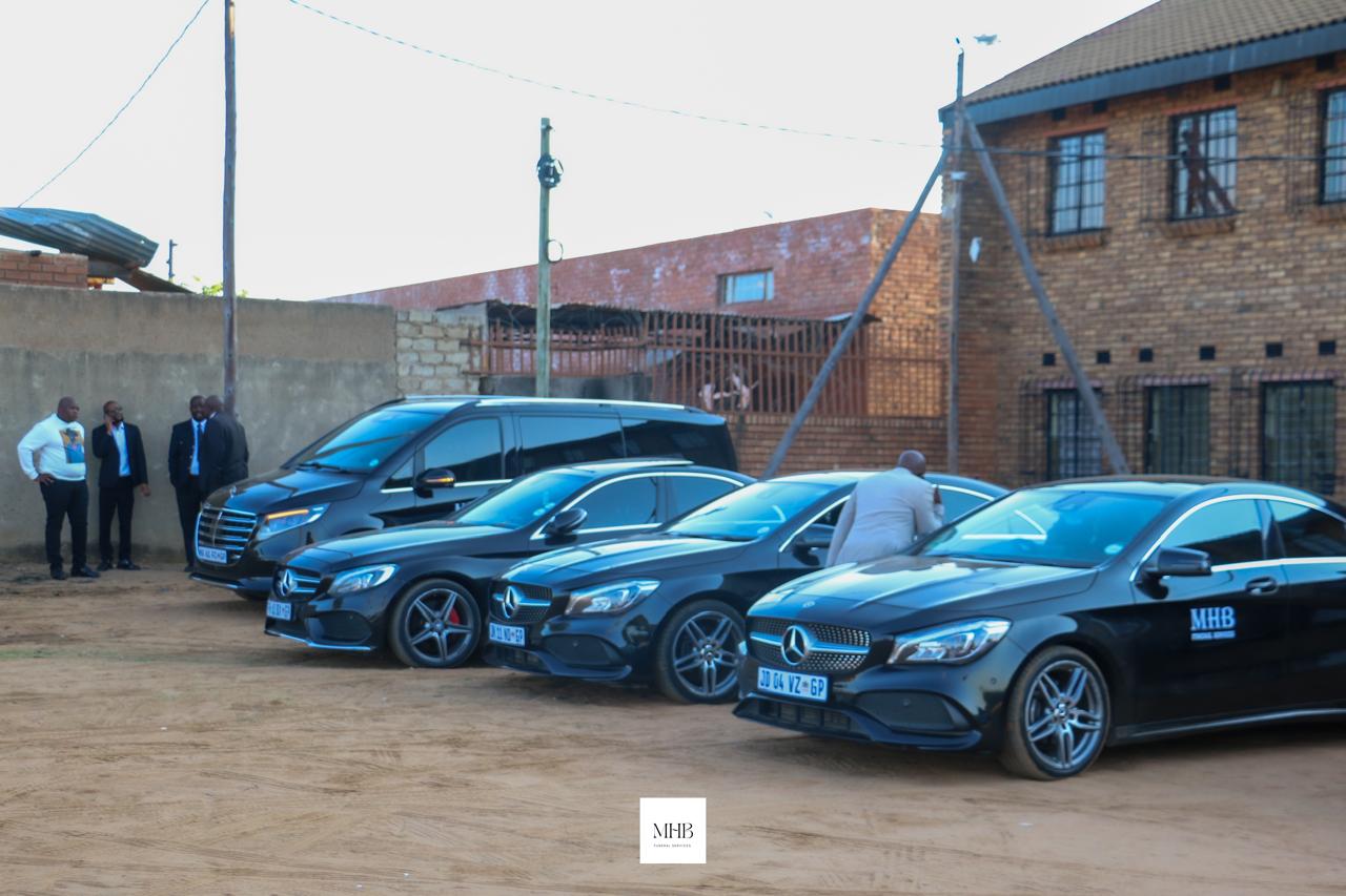 MHB Mercedes-Benz fleet lined up outside a family home